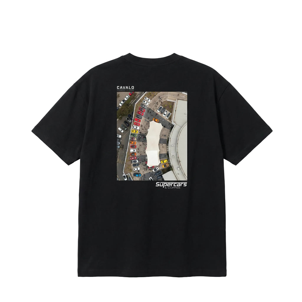 Black t-shirt with a photo print of a drone aerial shot of a car meet. The Cavalo Prestige logo is on the top left of the photo and the Supercars and Coffee logo is on the bottom right